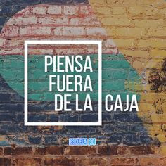 a brick wall with the words piensa fuera de la caja painted on it