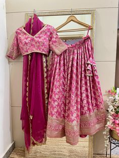 This is a Custom made Lehenga Choli dupatta.  I make it exclusively for my customers by using designer fabrics. I will only make it after you confirm your required size details. Handling time: Don't worry, just tell me, I will process it accordingly and deliver on or before a delivery date you mention. Size: This is custom made as per your size. This is not available in plus size. Post your order I will send you a measuremnts reference sheet using which you can provide details required to make your outfit. Fabric and work: Lehnga made in Embroidered silk Banarasi  fabric. Blouse is in heavy embroidered silk Dupatta is in Net with embroidery lace border on all sides of it. Dupatta is decorated with beautiful Sequine work all over as shown in the picture. Traditional Drape Lehenga With Cutdana For Ceremony, Pink Brocade Saree For Reception, Brocade Gown For Wedding And Festivals, Ceremonial Pink Gown With Zari Work, Bollywood Style Lehenga For Ceremony, Anarkali Style Lehenga For Ceremonial Occasions, Pink Sharara With Resham Embroidery For Ceremony, Anarkali Lehenga With Traditional Drape For Ceremony, Pink Semi-stitched Traditional Wear For Ceremony