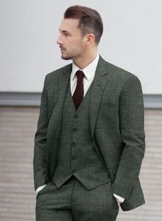 Looking for a suit that will make you feel sharp, polished and sophisticated, then you should go for our Italian Murano Bottle Green Wool Linen suit. Crafted from a Premium blend of wool, linen and silk, the texture on the green hue makes the suit especially versatile as well as will raise your interest level.   Look features a 2 button jacket with notch lapels, horn royal black buttons, single vent, three cuff buttons and two welted back pockets on trousers.  You can change the look during customization if required.   Lining: Viscose; Dry Clean. Blue Linen Shirt, Grey Wool Suit, Brown Corduroy Jacket, Cashmere Jacket, Tuxedo Shirts, Custom Suit, Linen Suit, Car Coat, Tuxedo Jacket