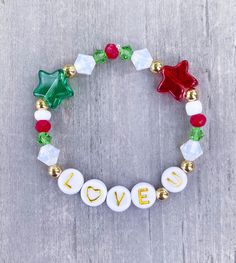 Love You Christmas Bracelet ️ Made with 18k gold filled beads. Personalize with name or word, please add in Personalization Section* CARING TIPS FOR YOUR JEWELRY ⭐️Treat and store with care. ⭐️ For longevity, avoid exposing your jewelry to water. ⭐️ Avoid having direct contact with lotions, perfumes, sanitizers as these chemicals may cause discoloration of your jewelry Festive Adjustable Personalized Bracelets, Gold Christmas Festive Bracelets, Gold Adjustable Charm Bracelet For Christmas, Gold Bracelets As Christmas Gifts, Gold Bracelets For Christmas Gift, White Bracelets As Holiday Gifts, Gold Beaded Christmas Bracelets, White Bracelets For Holiday Gifts, Gold Beaded Bracelets For Christmas