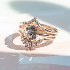 a close up of a ring on a white surface with light coming through the background