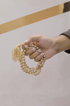 Experience the spiritual essence of devotion with our premium Tulsi Japa Mala, featuring 108 beads + 1 head bead, each handcrafted and polished to perfection. The beads are sized between 8 to 9mm, all nearly the same size, though slight variations may occur due to the handmade craftsmanship. What makes this mala unique is the intricate crafting process. As the beads are small, it requires great skill and precision to craft and polish each one. This process is time-consuming and can only be done Natural Wooden Beads Spiritual Bracelet, Wooden Beads Rosary For Meditation, Spiritual Beaded Bracelet With Large Beads For Meditation, Natural Hand-strung Beaded Necklace With Round Beads, Natural Color Hand-strung Beaded Necklaces With Round Beads, Natural Hand-strung Round Beaded Necklaces, Natural Hand-strung Beaded Necklace, Daily Meditation, 108 Bead