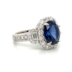 an oval blue sapphire and diamond ring