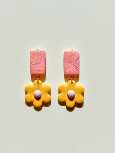 You just found some modern hand sculpted polymer clay earrings. They're great gift option for bridesmaids, birthdays or just for a fantastic woman in your life.  And yes - they're surprisingly lightweight - the biggest design weights only 7 grams (0.015 lb) C A R E   I N S T R U C T I O N S  - store in a clean, dry place.  Use of oils, creams, perfumes etc may effect longevity. To clean polymer clay pieces, rub gently with a soft, wet piece of cloth. If you own a white or light colored pair of e Arch Earrings, Clay Pieces, Tarnish Remover, Floral Arch, Yellow And Pink, Handcrafted Earrings, Handmade Business, Clay Art, Polymer Clay Earrings