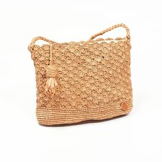 Raffia bag entirely hand crocheted in natural raffia from Madagascar Small shoulder bag, its strap is intertwined with a gold metal chain. - Materials: raffia and leather - Tea color -Fabric lining -Closing -Braided raffia shoulder strap -Dimensions: 27 x 21 cm, bottom: 6cm Woven Straw Crossbody Beach Bag, Summer Woven Straw Crossbody Bag, Summer Handwoven Crossbody Shoulder Bag, Summer Woven Crochet Crossbody Bag, Summer Crochet Woven Crossbody Bag, Handwoven Crossbody Shoulder Bag For The Beach, Daily Use Straw Crochet Crossbody Bag, Brown Straw Crochet Crossbody Bag, Beach Jute Crossbody Straw Bag