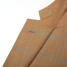 NEW Condition, no signs of wear Estimated US Size: 40 Tan Herringbone with Blue Windowpane Made of Wool One Button Closure Double Vented Working Sleeve Buttonholes - 4 Button Half Lined Flap Pockets Notch Lapel Made In England Measurements Shoulder: 18.75" Jacket Length: 29.75" Sleeve Length (top of the shoulder seam to the edge of the vented side of the sleeve): 25.5" Chest: 41.5" Waist: 39" This product is located in our EU warehouse. Brown Fitted Tweed Jacket With Single Button, Fitted Brown Tweed Jacket With Single Button, Brown Single Button Fitted Tweed Jacket, Fitted Brown Single Button Tweed Jacket, Beige Sport Coat With Suit Collar And Button Closure, Beige Sport Coat With Notch Lapel And Buttons, Tailored Beige Sport Coat With Buttons, Tailored Tweed Jacket With Button Closure And Lapel Collar, Fitted Brown Tweed Jacket With Concealed Placket