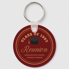 a red round keychain with the words class of 1965 reunion and graduation cap on it