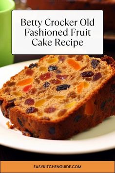 a close up of a slice of cake on a plate with the words betty crocker old fashioned fruit cake recipe