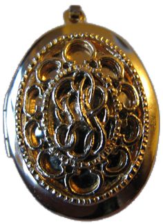 a gold colored pocket watch with an intricate design