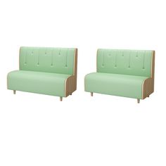 two green couches sitting next to each other