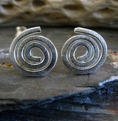 Small artisan handmade spiral swirl post earrings. The Details ∞ Artisan handmade jewelry ∞ Sterling Silver ∞ Small Spirals (approx 9-11mm) ∞ Earring backs included ∞ Made to order ∞ Gift box included ∞ Made in the USA Check out our huge selection of stud earrings here... https://www.etsy.com/shop/PoseidonsBooty?search_query=stud+earrings VISIT OUR SHOP: http://www.PoseidonsBooty.etsy.com SHOP POLICIES: http://www.etsy.com/shop/PoseidonsBooty/policy Modern Swirl Earrings For Gift, Modern Twist Swirl Earrings For Gifts, Unique Swirl Earrings As Gift, Unique Swirl Earrings For Gifts, Prescott Az, Artisan Jewelry Handmade, Solid Gold Earrings, Spiral Earrings, Earrings Inspiration