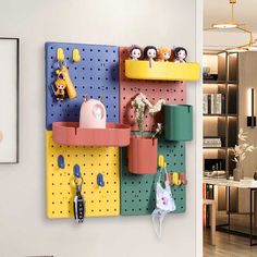 a colorful peg board with toys and other items on it in a living room area