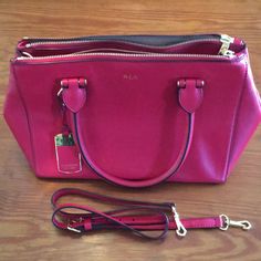 This Is A True Red Leather Ralph Lauren Handbag. The Lighting Makes It Look Fuchsia But It Is A True Red Like The Color Of The American Flag Stripes. It Is Very Gently Used And In Excellent Shape As You Can See In The Pictures. The Lining Is Immaculate And The Exterior Has No Flaws. It Has 3 Separate Compartments, 2 With Zipper Closures And The Center Closure Is A Double Magnet. There Are 4 Interior Pockets, One With A Zipper And One With A Snap. It Has Carry Handles As Well As An Adjustable Dro Rectangular Red Satchel With Zipper Closure, Classic Red Handheld Satchel, Classic Handheld Red Satchel, Red Handheld Satchel With Zipper Closure, Ralph Lauren Satchel Bag, Classic Ralph Lauren Crossbody Bag, Ralph Lauren Formal Shoulder Bag, Red Satchel With Zipper Closure And Double Handle, Classic Red Bag With Handles