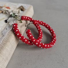 Stylish red and white polka dot beaded hoop earrings. ♥ SIZE (approximately diameter) : 1.1 inch 1.4 inch 1.6 inch 2.2 inch  ♥ 100% handmade ♥ Packed in gift box ♥ Very light ♥ If you like this item in a different color - send me a message, please. Feel free to communicate with me Advice on use and care * Never wear any jewelry while bathing or showering. Chlorine can cause damage. Please do not swim and did not take a shower in beaded jewelry * Try to avoid the drop, shock and compression of jewelry from beads Since this is handmade item, every new good may be vary slightly, but the overall look will match that shown on the photo. You can see more hoop earrings in my shop https://www.etsy.com/shop/IvonaHMJewelry?ref=seller-platform-mcnav&section_id=22254200 Hoop Earrings Big, Polka Dot Earrings, Dot Earrings, Earrings Big, Handmade Beaded Jewelry, Earrings Red, Beaded Hoop Earrings, Red Polka Dot, Beaded Hoops