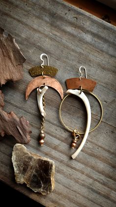 Lightweight Hammered Brass and patinad copper mismatch Raccoon bone earrings with 14k filled hooks. Hammered Brass, Crafted Jewelry, Mixed Metals, Handcrafted Jewelry, Metal Working, Jewelry Crafts, Jewelry Earrings Dangle, Bones