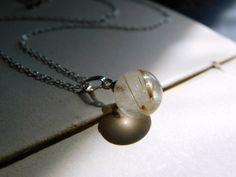 "A very stunning but small quartz crystal ball full of golden rutiles, is suspended from a 16\" sterling silver dainty chain with a golden tourmaline rondelle on each end. The crystal ball is just 5/8\" in diameter, but packs a mighty little punch in color. Enjoy!" Minimalist Jewelry With Natural Inclusions For Everyday, Minimalist Everyday Jewelry With Natural Inclusions, Minimalist Pendant Necklace With Natural Inclusions, Crystal Ball Jewelry, Magic Necklace, Ball Jewelry, Antler Ring, Golden Rutilated Quartz, Scented Sachets