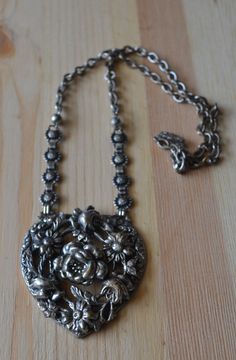 "This necklace is made of silver plated base metal and features a large floral design heart pendant on a matching chain. There are some minor plating losses but overall condition is good. The heart pendant part is ~2\" tall Item is sold as-is. We welcome haggling in this shop!" Necklace Art Deco, Flapper Necklace, Filigree Heart, Art Deco Silver, Necklace Art, Carnelian Pendant, Floral Heart, Rose Necklace, Necklace Rose