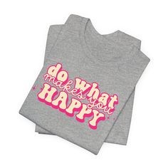 Embrace a positive mindset with our "Do What Makes You Happy" Graphic Tee. Featuring a retro pink font, this shirt is not just a piece of clothing but a daily reminder to prioritize your happiness. The uplifting message adds a touch of positivity to your wardrobe, making it an ideal choice for casual outings or a comfortable statement at home. Crafted for both style and comfort, this tee encourages you to express your individuality and live by the mantra of happiness. Spread good vibes wherever you go with this inspirational quote shirt. Grab yours now and let your clothing speak volumes about your positive outlook! Uplifting Gifts, Apparel Merchandising, Quote Shirt, Uplifting Messages, Positive Outlook, What Makes You Happy, Positive Mindset, Shirts With Sayings, You Happy