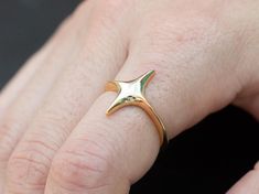 N O L O Jewelry Statement #119: "You Shine With Radiate brilliance and elegance." Embrace the celestial allure with our adjustable radiant star ring. Available in both gold and sterling silver options, this ring features a dazzling four-pointed star that adds a touch of style to your ensemble. The adjustable design ensures a perfect fit for any finger, making it a versatile piece for daily wear or special occasions. Crafted with precision and care, this ring is a testament to timeless elegance a Four Point Star, Gold And Silver Rings, Sugar Cravings, Jewelry Statement, Jewelry Lookbook, Star Jewelry, Star Ring, Gold Star, Finger Ring