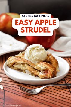 a white plate topped with pancakes and ice cream next to an apple on a table