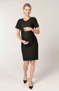 This maternity dress is a remix of a classic A-line design, featuring a sheath silhouette and stretch built for every phase ofpregnancy. Hidden zips under princess seam allow for discreet breastfeeding access. 38 1/2" length Jewel neck Back zip closure Short sleeves 38% recycled polyester, 36% polyester, 21% viscose, 5% elastane Hand wash, dry flat Imported Elegant Short Sleeve Maternity Dress Bump Friendly, Elegant Bump-friendly Maternity Dress, Elegant Fitted Maternity Dress Nursing Friendly, Nursing Friendly Fitted Knee-length Dress, Knee-length Fitted Nursing-friendly Dress, Fitted Short Sleeve Bump Friendly Maternity Dress, Fitted Short Sleeve Maternity Dress Nursing Friendly, Fitted Bump Friendly Maternity Dress With Short Sleeves, Fitted Black Maternity Dress