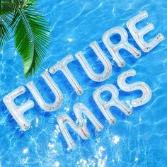 the word future mars written in clear blue water next to a palm tree and pool