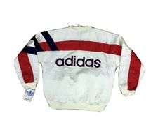 Vintage Deadstock 80s Adidas Satin Bomber Jacket NWT. Shipped with USPS Priority Mail. Vintage 80s deadstock Adidas bomber jacket tagged M fits L/XL Condition 9.5/10 light yellowing from storage, nwt Measurements Pit to pit 24” Top to bottom 28” All items are sold as is and and are mostly pre-loved pieces so expect some general wear. I do my best to describe any major defects/flaws in a piece; or take pictures of the defect. As well as I occasionally miss flaws and make mistakes on seizing so pl Vintage White Cotton Windbreaker, Vintage White Windbreaker For Fall, White Vintage Windbreaker For Fall, Adidas Long Sleeve Windbreaker With Three Stripes, Red Vintage Crew Neck Outerwear, White Vintage Crew Neck Outerwear, Vintage White Crew Neck Outerwear, Vintage Adidas, Adidas Jacket