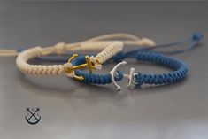 two blue and white bracelets with an anchor