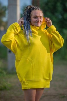 "Unisex bright yellow sweatshirt hoodie. Long oversize big hood cotton hoodie for man or woman. Extra long sleeves. Perfect hoodie for travelling. Large hood keeps your head warm. Two pockets in front. HQ-Heavy duty material. Density - 280g/m2. Made in EU. FABRIC: 82 % cotton 8% polyester. Size S Length front (in/cm) 31.5/80 Length back (in/cm) 33/85 Width (in/cm) 24.4/62 Sleeve length (in/cm) 26.4/67 Size M Length front (in/cm) 33/84 Length back (in/cm) 35/89 Width (in/cm) 25.6/65 Sleeve length Solid Hoodie With Adjustable Hood And Funnel Neck, Oversized Long Sleeve Sweatshirt For Outdoor, Yellow Long Sleeve Relaxed Fit Sweatshirt, Yellow Hooded Casual Sweater, Casual Yellow Hooded Sweater, Yellow Long Sleeve Sweater For Streetwear, Oversized Hoodie Sweatshirt For Outdoor, Oversized Outdoor Hoodie Top, Oversized Hoodie Top For Outdoor