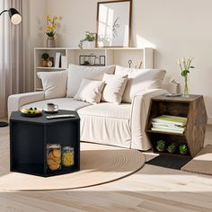 a living room filled with furniture and lots of white pillows on top of a rug