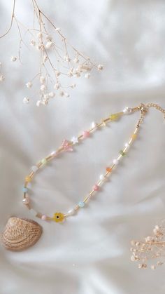 Colourful Necklace, Friendship Necklace, Beaded Choker Necklace, Flower Necklace, Gemstone Necklace, Gift for Girlfriend ✨A unique colourful necklace is made of high quality glass beads, genuine freshwater pearls and multicolour gemstone chips. ✨ Features with a 18k gold plated lobster clasp  - Nickel Free 🌷 The length is 14 inches with 2 inch adjustable chain It is a perfect piece to add a nice touch for your picnic outfits! 🦄 N O T E -- - not stretchy - includes one (1) necklace only - metal findings are 18k gold-plated, nickel free - will be packaged in a tiny jewelry bag + bubble mailer ️ *Each beautifully beaded bracelet is handmade uniquely for you. Visit my shop to check out more charming jewellery!  https://www.etsy.com/ca/shop/molamolabeads?ref=seller-platform-mcnav I hope to pr Trendy Multicolor Flower Necklace With Colorful Beads, Dainty Multicolor Flower Necklace, Trendy Beaded Flower Necklace Gift, Trendy Flower Beaded Necklaces As Gifts, Trendy Flower Shaped Beaded Necklaces As Gift, Multicolor Flower-shaped Necklaces For Jewelry Making, Yellow Flower Necklace With Colorful Beads As Gift, Multicolor Beaded Necklace With Flower Pendant For Gift, Multicolor Beaded Necklace With Flower Pendant