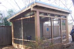 a person standing in front of a small shed