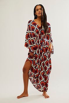 Billowy and breezy, vibrant and eye-catching, this so special kaftan is perfect for brunches, beach days, and everything in between. **Fit:** Maxi length, relaxed and oversized **Features:** Super mod, retro print, relaxed sleeves, pull-on style, deep-v neckline, ruched detailing, soft comfy fabrication **Why We | Groovy Baby Maxi Kaftan Dress by Free People in Yellow Bohemian V-neck Kaftan For Brunch, Maxi Length Beachwear Cover-up For Brunch, Relaxed Fit V-neck Beach Dress For Vacation, Flowy V-neck Beach Dress For Resort, Boho Print Maxi Length Beach Dress For Beach Party, Chic Multicolor Maxi Dress For Beach Cover-up, Flowy Boho Print Maxi Dress For Beach Party, Summer V-neck Relaxed Fit Kaftan, Boho Print Beachwear Maxi Dress For Beach Party