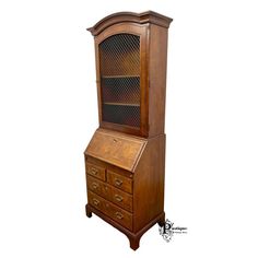 an old fashioned wooden desk with drawers