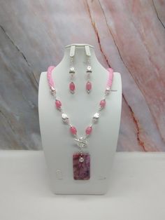 "Handmade and designed by me-one of a kind necklace set-spiral bead crochet necklace with pink seed beads-24\" long-a 2 1/4\"x1 1/4\" rectangle crazy lace agate pendant beads-quartz barrel beads-silver tone metal tear drop beads-metal beads-2 1/2\" long matching dangle earrings with an ear wire-toggle clasp is in the front-silver tone findings. This beautiful summer necklace set would make great addition to your jewelry wardrobe! The necklace is easy on because of the toggle clasp is in the front!" Pink Bohemian Jewelry With Faceted Beads, Bohemian Pink Jewelry With Faceted Beads, Pink Natural Stones Beads As Gift, Pink Beaded Chain Jewelry For Gift, Pink Spiral Jewelry For Gifts, Spiral Pink Jewelry For Gifts, Pink Dangle Jewelry With Faceted Beads, Pink Bohemian Beaded Jewelry, Pink Beaded Dangle Jewelry