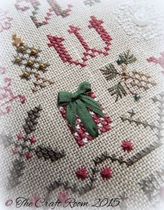 a close up of a cross stitch pattern