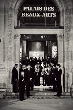 black and white photograph of people standing in front of an art gallery with the words palais des beaux - arts