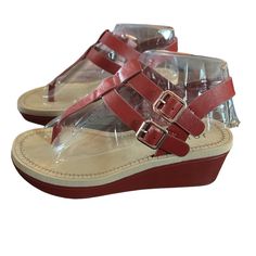 Give Off An Effortless Look For The Sunny Weather With The Bianca Wedge Sandal From Journee Collection. This Silhouette Is Fashioned With T-Strap Styling And Side Buckle Details For Extra Intrigue! Faux Leather Upper Adjustable Buckle Closures Round Open Toe Synthetic Lining Lightly Padded Footbed 1" Platform, 2¼" Covered Wedge Heel Rubber Sole Imported New In Box Size 6 Red Open Toe T-strap Sandals, Red T-strap Sandals With Ankle Strap, Red Ankle Strap T-strap Sandals, Red T-strap Sandals For Summer Beach, Red T-strap Sandals With Round Toe For Summer, Red Sandals With Buckle Closure For Summer, Red Open Toe T-strap Sandals For Beach, Red Sandals With Buckle Closure For Beach, Red Buckle Closure Sandals For Beach