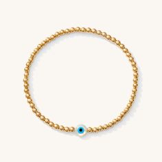 In many cultures, the Evil Eye is said to bring good luck and ward off misfortune. Whether worn for its cultural significance or simply for its beauty, this bracelet will stand out beautifully in your everyday stack. Pair it with our classic evil eye bracelet for extra luck. 14k Gold Fill 3 mm Genuine Mother-of-Pearl bead imported from Greece Sizing: 6.3" and stretches to 7". Please measure wrist prior to ordering, as we do not offer custom sizes. Gold Beaded Evil Eye Bracelet, Adjustable Gold Evil Eye Bracelet With 8mm Beads, Dainty Gold Evil Eye Bracelet, Adjustable, Cheap Gold Hand-strung Evil Eye Bracelet, Gold-plated Evil Eye Bracelet With Adjustable Chain, Small Bead Bracelet, Evil Eye Bracelet, Evil Eye, Pearl Beads