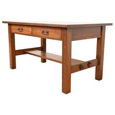 a wooden table with two drawers on one side and an open drawer on the other