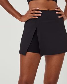 Powered by our fan-favorite Booty Boost® short that is inconspicuously designed under the skort, this style offers sculpting, an added booty lift and a held in feel. | Spanx Women's SPANXshape Get Moving Contour Rib Skort Fitted Short Sporty Skort, Fitted Mini Skirt With Built-in Shorts For Workout, Fitted Workout Skort With Built-in Shorts, Functional Fitted Athletic Shorts With Short Inseam, Black Fitted Functional Skort, Functional Black Fitted Skort, Fitted Athleisure Skort With Built-in Shorts, Fitted Activewear Mini Skirt With Built-in Shorts, Athleisure Fitted Skort With Built-in Shorts