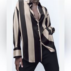 Zara Oversized Satin Striped Button Down Shirt Size M Worn Once By Me And I Cut The Tags Out Bc I Hate Tags On Clothing Long Sleeve Black And Cream Button Down Shirt!! Size M New With Tags It’s Missing The Second Button On The Top 100% Polyester Made In Morocco Chic Oversized Striped Top, Striped Oversized Button-up Blouse, Oversized Striped Button-up Blouse, Elegant Oversized Button-up Shirt, Trendy Oversized Striped Blouse, Oversized Beige Blouse With Button Closure, Elegant Oversized Shirt With Button Closure, Oversized Cream Long Sleeve Shirt, Chic Oversized Blouse For Office