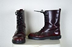 Vintage 1990's oxblood red leather combat boots ~ the coolest pair of combat boots in the most perfect shade of patent leather oxblood red! Similar to the very classic Doc Martens boots but made in Italy. These are just great and make me want to put them on with an oversized flannel and throw my hair around to some of Seattle's best. They are a bit taller than the shortest 8 eye Docs, they have 9 eyelets, rise to around mid calf and have brass studs near the top. MATERIAL leather upper and linin Red Combat Boots, Combat Boots Men, Doc Martens Boots, Leather Combat Boots, Oxblood Red, Oversized Flannel, Doc Martens, Cherry Red, Boot Shoes Women