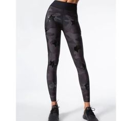 Pre Owned Ultracor High Silk Camo Knockout Leggings Yoga Black Gray With Stars Size Small In Excellent Condition With No Damage Or Any Flaws. See Pictures For More Details This Is The Essential Compression Legging With A High, Supportive Waistband And Sleek Fit For Sculpted Support In Activity And Beyond. Glossy Star Appliques Throughout Elevate These High-Tech And Functional Leggings To An On-Trend Look Sure To Turn Heads In The Studio And Also On The Streets. Made Of High Stretch, Silky-Soft Compression Fabric With Built In Shapewear For An Instant Butt Lift High Rise Black Camo Print With Shiny Stars Polyester, Nylon, Lycra Fit Compression Performance Running, Training, Yoga Black A Gray Camo, Compression Fabric, Compression Leggings, Black Camo, Running Training, In The Studio, Camo Print, The Studio, High Tech