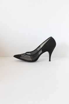 Vintage 1950s/1960s Fiancées heels in black mesh with solid black pointed toe, solid black fabric covered stiletto heel, and leather sole. Good vintage condition with some overall wear and some areas of visible glue (see photos). measurements: insole length: 10.25" width: 3" heel height: 3.5" size marked: US women's 7.5AAA but please check all measurements as vintage sizing varies label: Fiancées Please, take these measurements into consideration and compare them to a similar item of your own to ensure a good fit. All sales final. shop more vintage shoes: http://etsy.me/1P7ea9I visit the shop: https://www.etsy.com/shop/tobedetermined Vintage Shoes, Black Mesh, Vintage 1960s, Fabric Covered, Stiletto Heel, Womens Heels, Vintage 1950s, Black Fabric, Solid Black