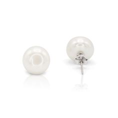 These freshwater pair of stud earrings are crafted in Sterling silver with white high luster AAA+ button pearls. It is an elegant classic set and ready for any occasion. A must-have pair in every woman's wardrobe. Match these stud earrings with our classic pearl bracelet or necklace collection. Product Type: Earrings| Stud | Pushback Closure Pearl Shape: Button  Pearl Type: Freshwater  Pearl Color: White  Metal: S925 Sterling Silver Needle  Pearl Sizes: 8mm, 10mm Pearl Grade: AAA+  Earring Weigh Classic White Gold Pearl Charm Earrings, Classic Hypoallergenic Bridal Earrings For Formal Occasions, Classic Round Pearl Earrings, Classic White Gold Hypoallergenic Pearl Earrings, Elegant Nickel-free Pearl Earrings, Classic White Gold Earrings With Pearl Charm, Classic White Gold Pearl Earrings For Anniversary, Formal White Gold Pearl Earrings Nickel-free, Classic Hypoallergenic White Gold Pearl Earrings