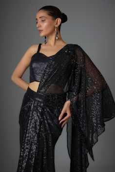 Black pre-stitched saree with sequin embellishments. Comes with padded embellished blouse. - Aza Fashions Party Saree Sets With Draped Sleeves, Elegant Fitted Pre-draped Saree With Mirror Work, Party Sets With Draped Sleeves Saree, Glamorous Party Pre-draped Saree With Cape Sleeves, Festive Pre-draped Party Sets, Unstitched Blouse Piece With Cape Sleeves For Party, Festive Party Wear Blouse With Draped Sleeves, Party Embellished Pre-draped Saree With Cape Sleeves, Georgette Saree With Cape Sleeves For Parties