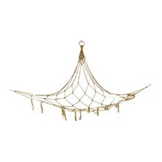 a gold colored hammock hanging on a white wall