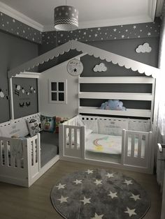 the baby's room is decorated in grey and white