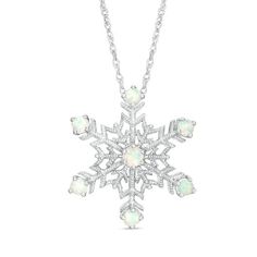 With a flurry of sparkle, this vintage-inspired snowflake pendant is a lovely addition to any attire. Crafted in sterling silver, this wintery design showcases a 3.0mm lab-created iridescent opal cabochon centered in a hexagon shape lined with intricate milgrain detailing. Lending a frosty shimmer to this keepsake look, each of the six arms is punctuated with a 2.5mm lab-created iridescent opal cabochon. Polished to a bright shine, this pendant suspends along an 18.0-inch rope chain that secures Gold Snowflake Necklace, Snowflake Jewelry, Snowflake Necklace, Snowflake Pendant, Hexagon Shape, Rope Chain, Cute Jewelry, Necklace Designs, Spring Rings